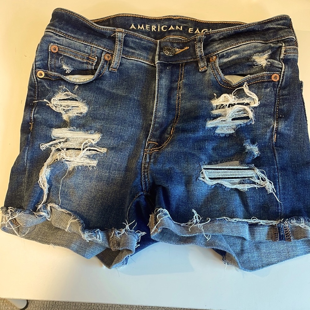 American Eagle Next Level Stretch High Rise Shortie Shorts. Denim. Woman size 0